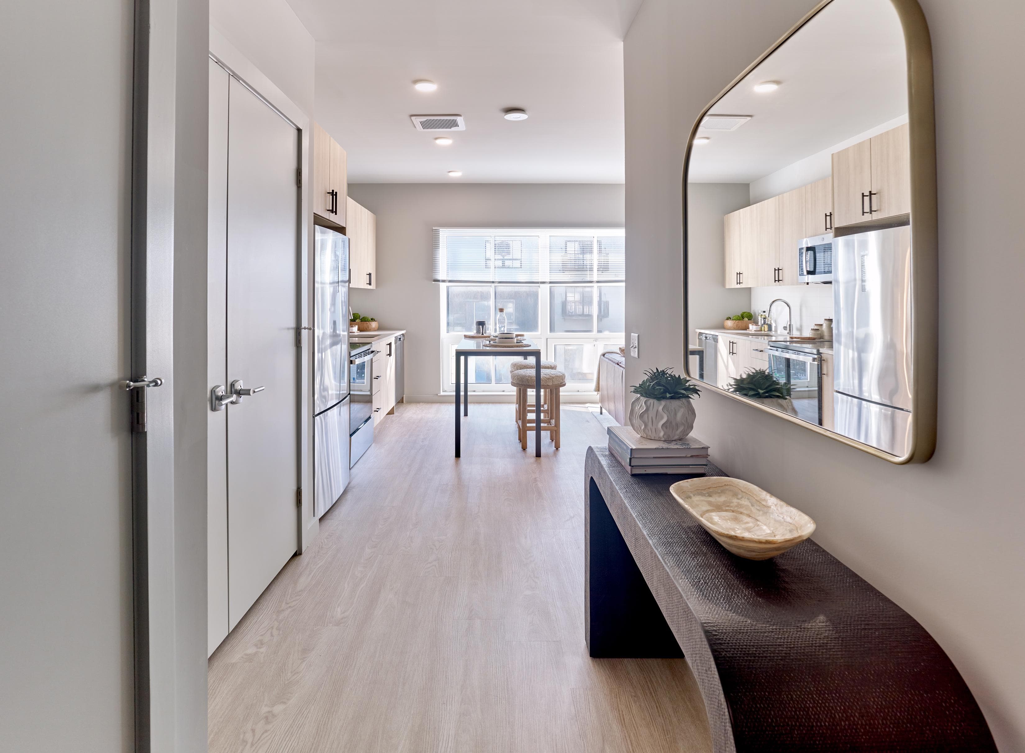 Hallway leading into a kitchen in one of The Winston's luxury apartments in New Haven, CT